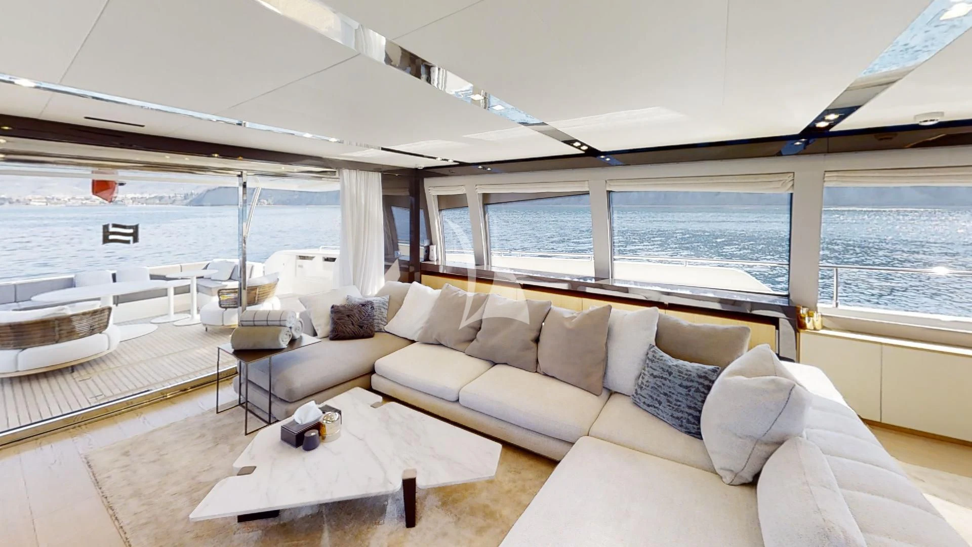 a living room with a large window aboard DAMARI Yacht for Charter