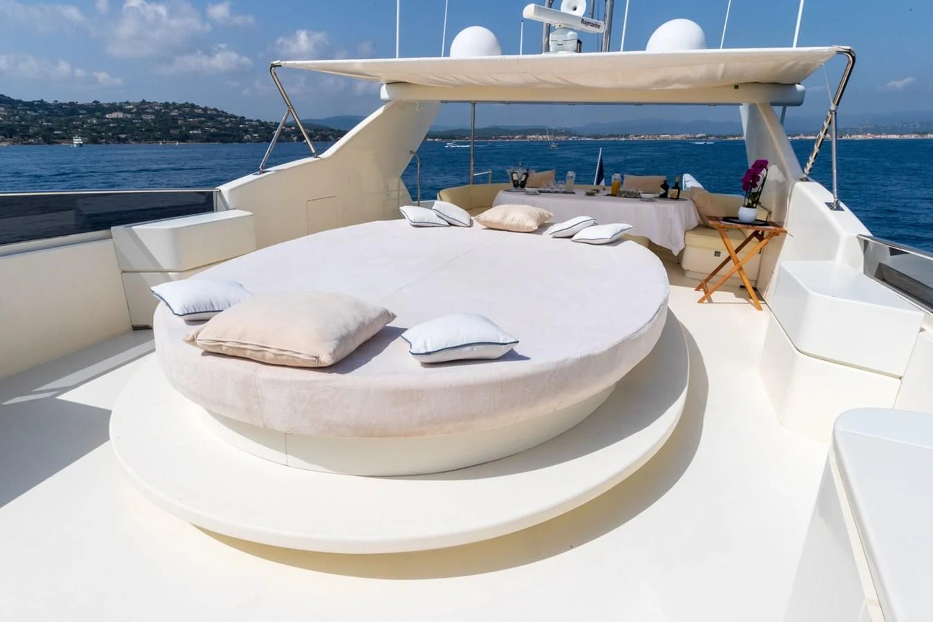 a white boat on a deck aboard BEIJA FLORE Yacht for Charter
