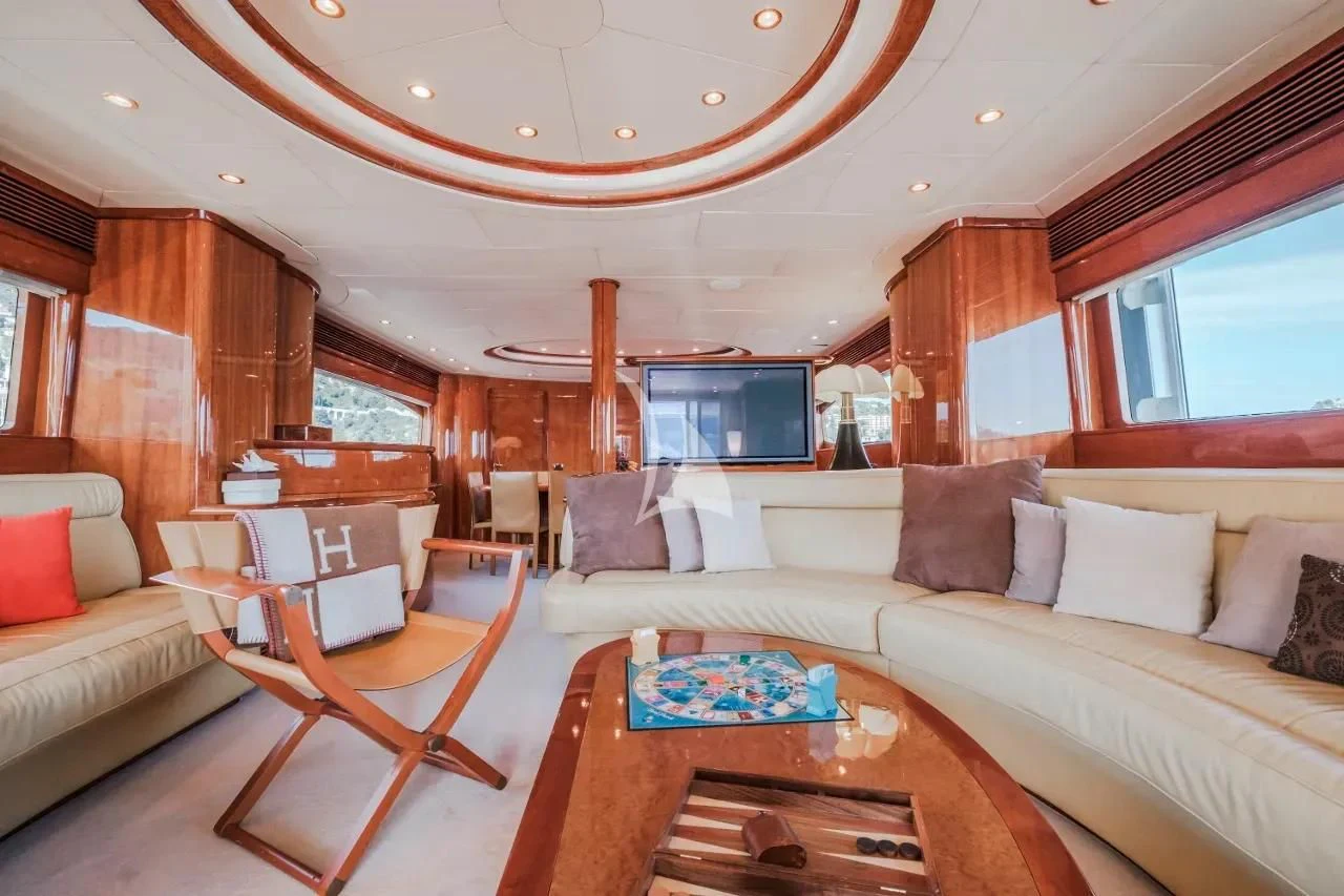 a living room with a couch and a table aboard BEIJA FLORE Yacht for Charter