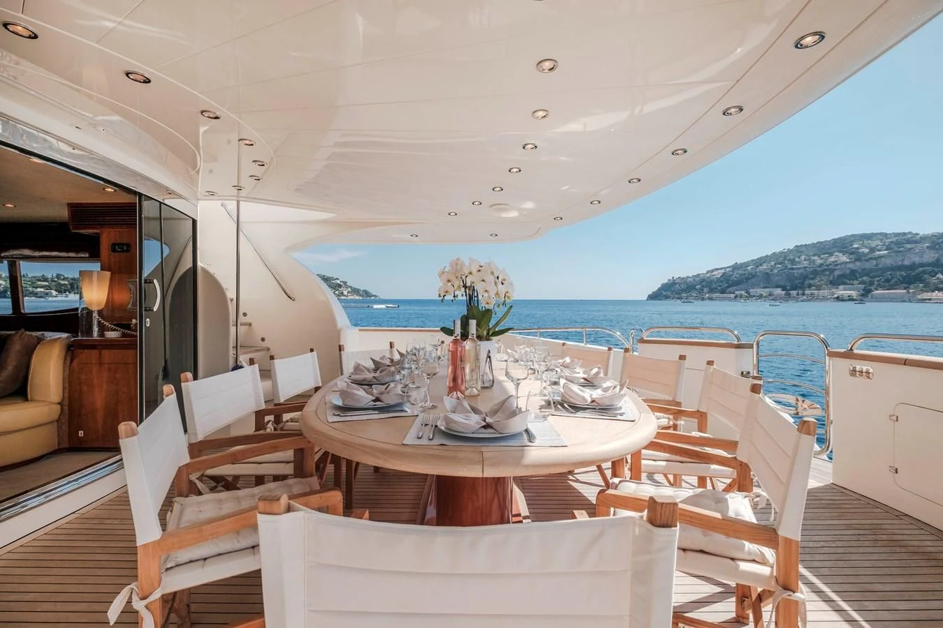a boat with a table and chairs aboard BEIJA FLORE Yacht for Charter