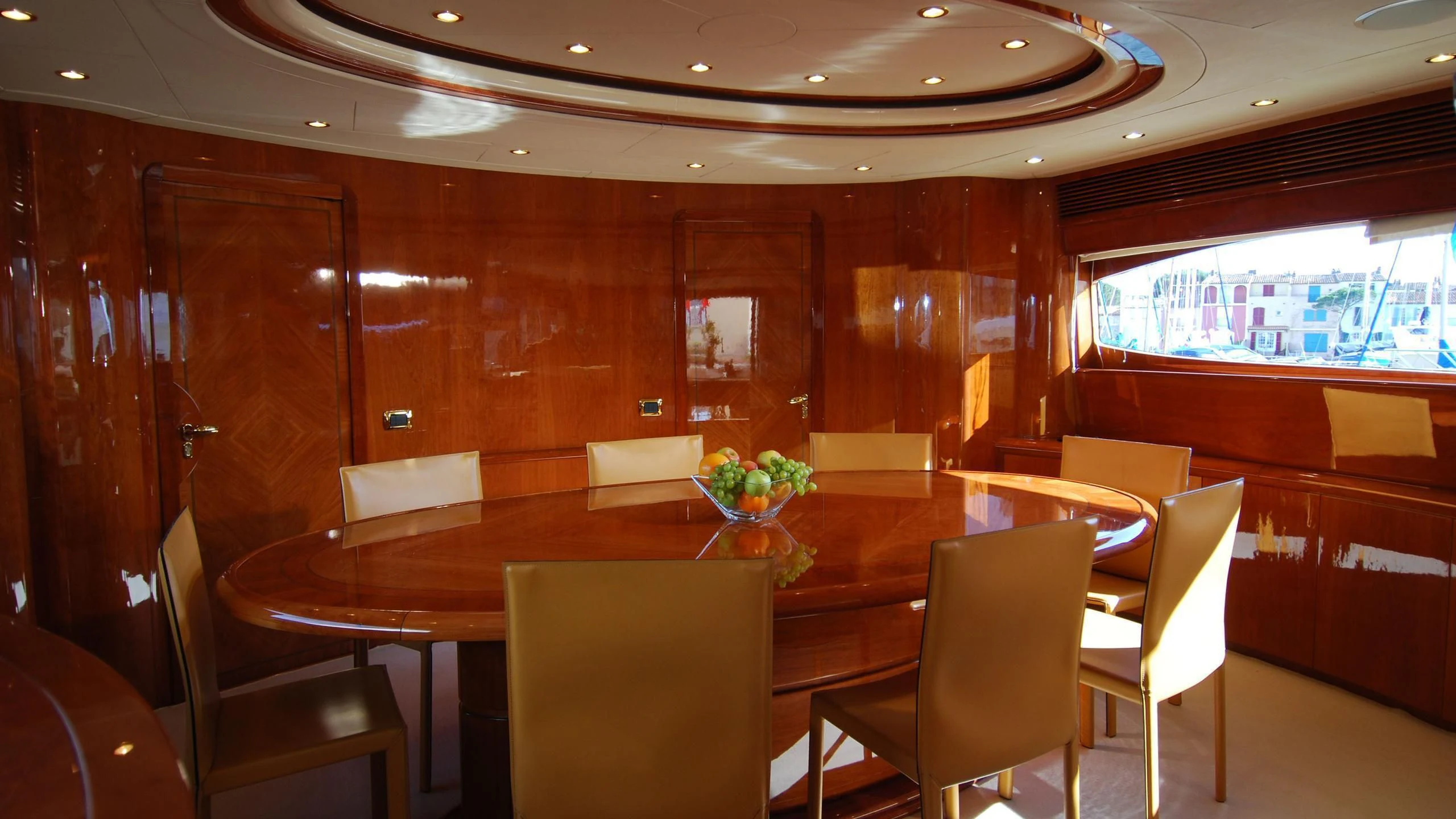 a room with tables and chairs aboard BEIJA FLORE Yacht for Charter