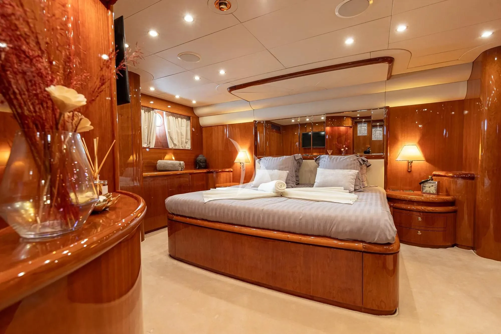 a large bed in a room aboard BEIJA FLORE Yacht for Charter
