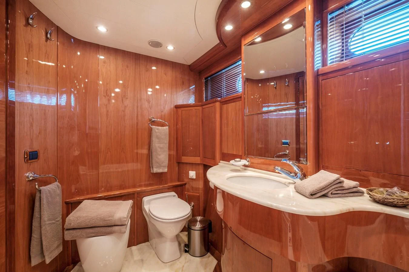 a bathroom with a wood wall aboard BEIJA FLORE Yacht for Charter
