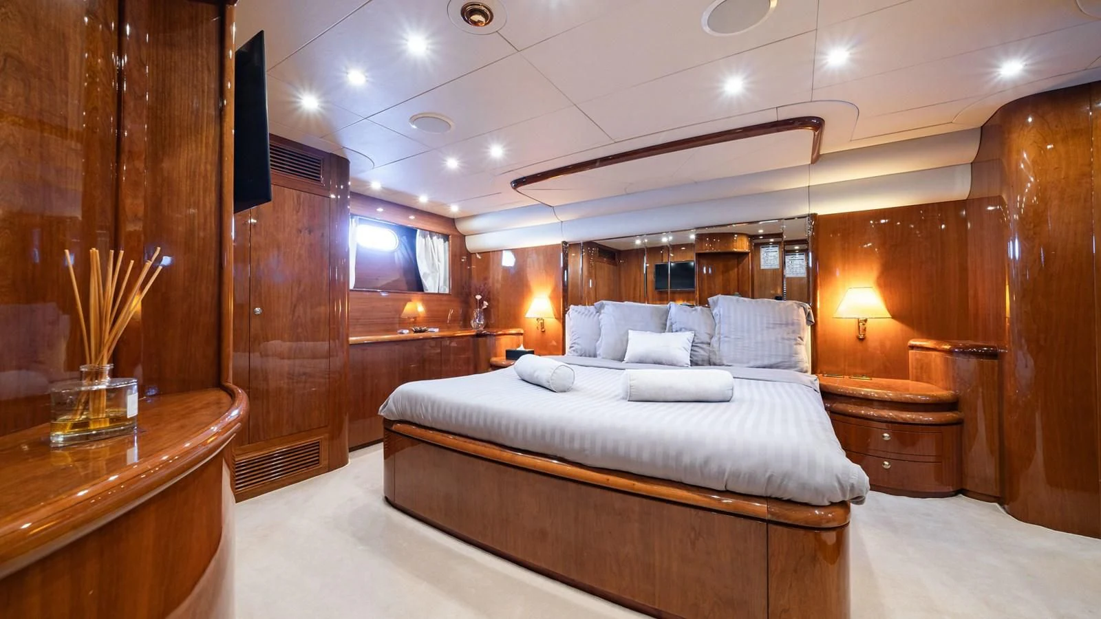 a room with a bed and a desk aboard BEIJA FLORE Yacht for Charter