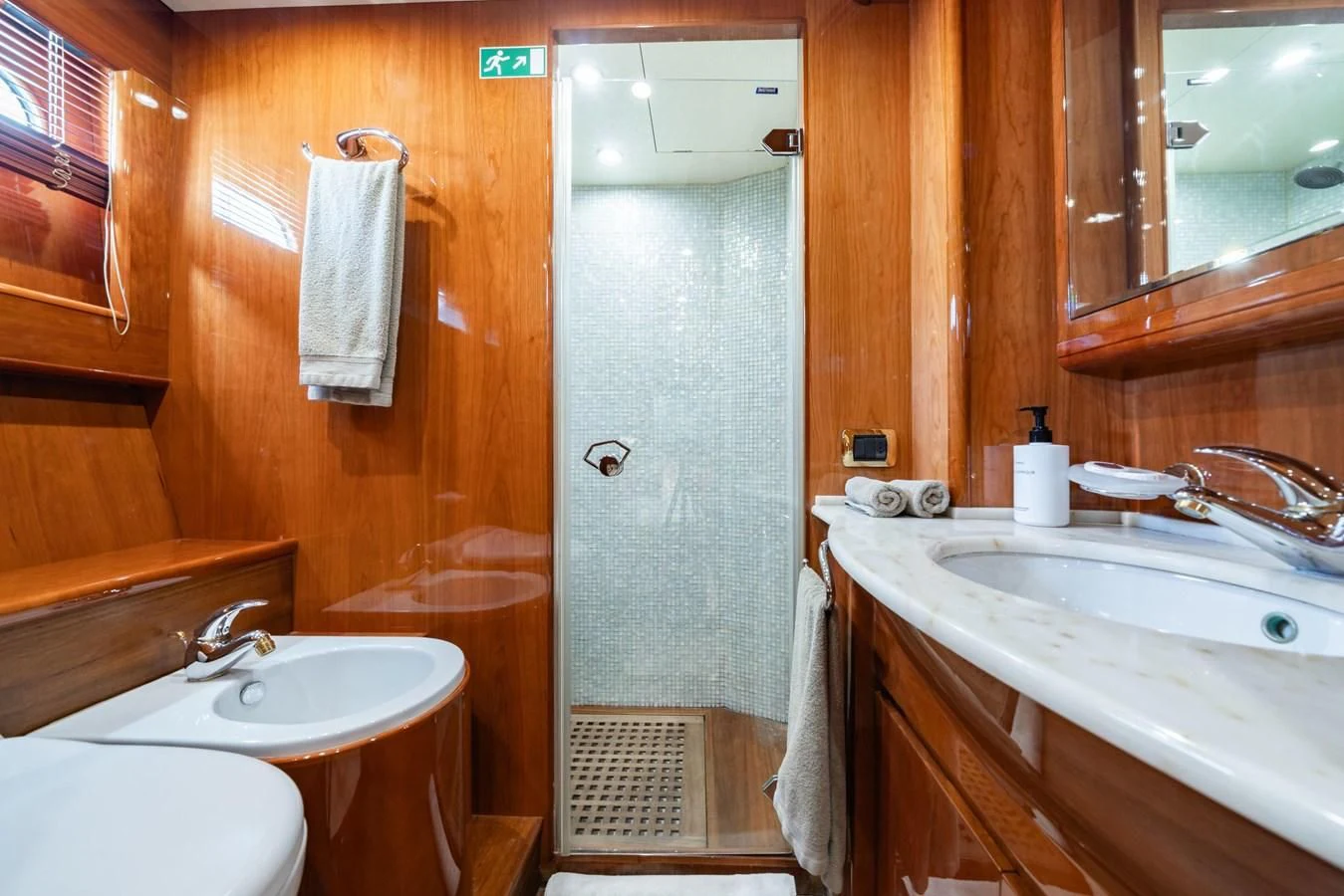 a bathroom with a shower sink and a bathtub aboard BEIJA FLORE Yacht for Charter