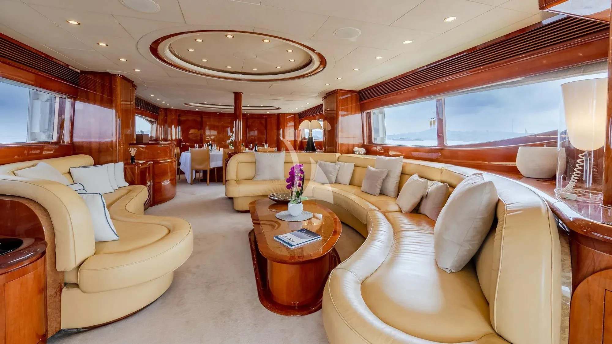 a large living room with a large window aboard BEIJA FLORE Yacht for Charter