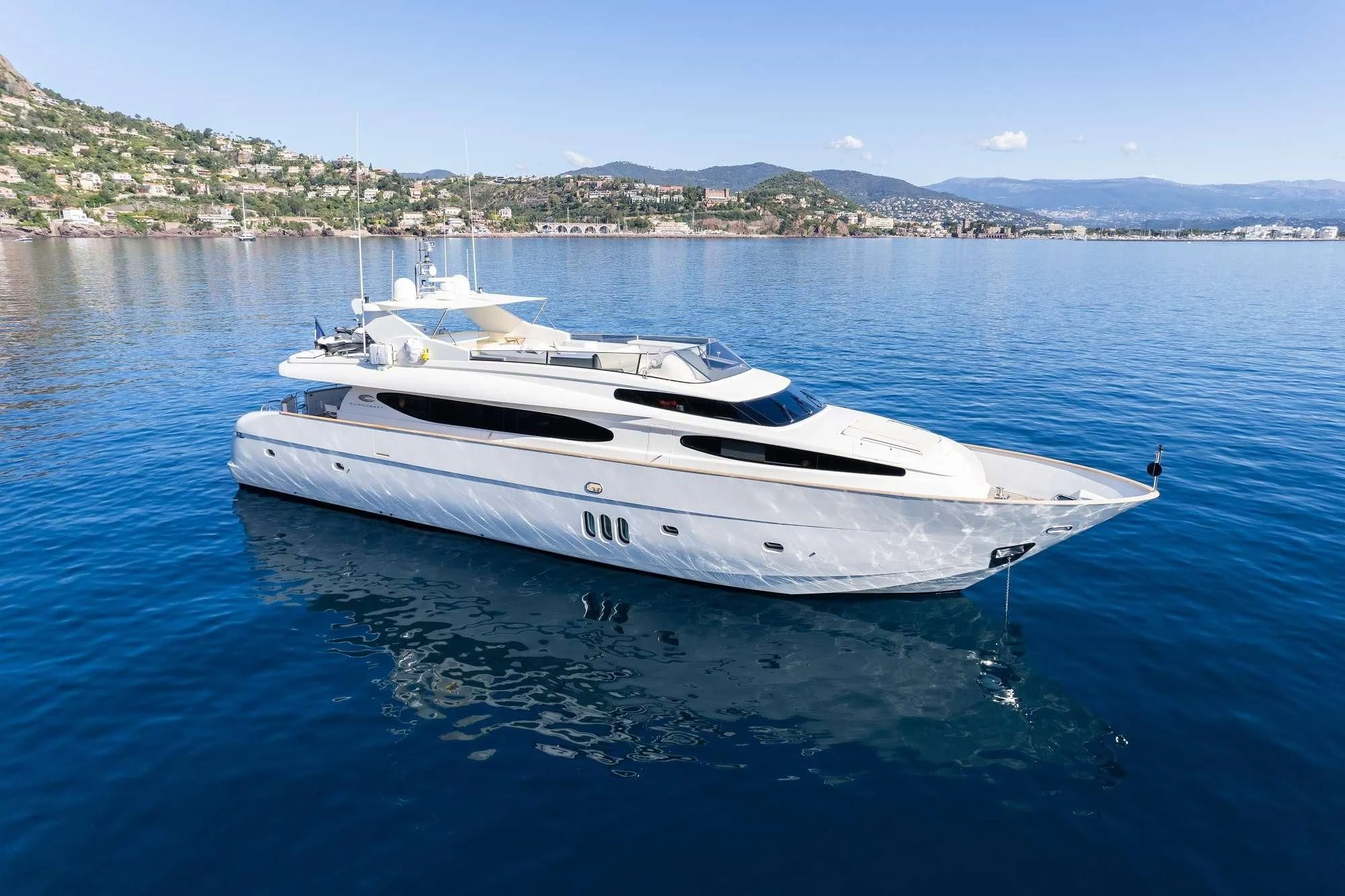 a white boat on the water aboard BEIJA FLORE Yacht for Charter