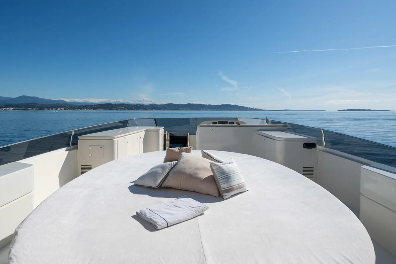 a large white bed on a boat aboard BEIJA FLORE Yacht for Charter
