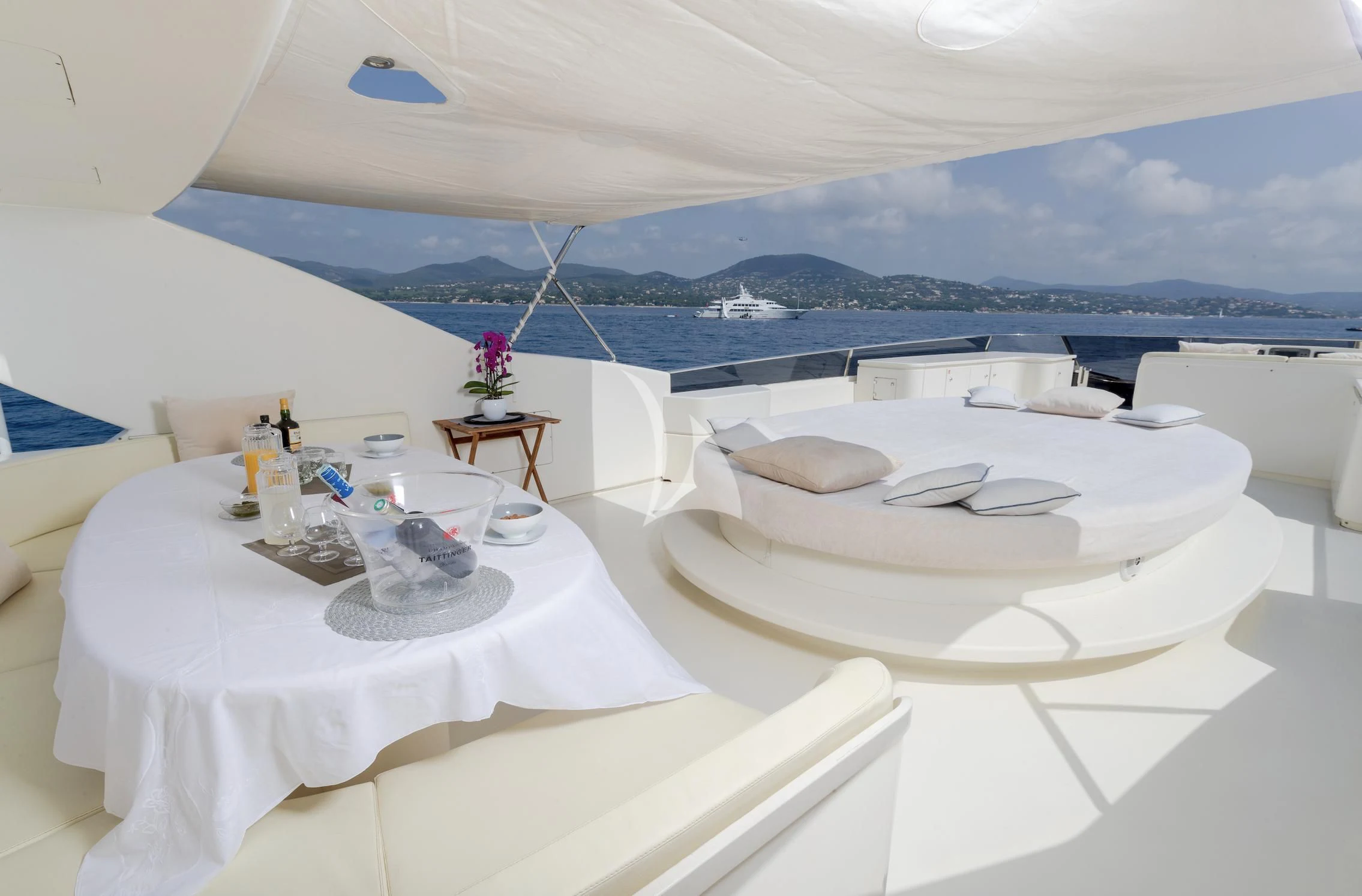 a room with a table and chairs aboard BEIJA FLORE Yacht for Charter