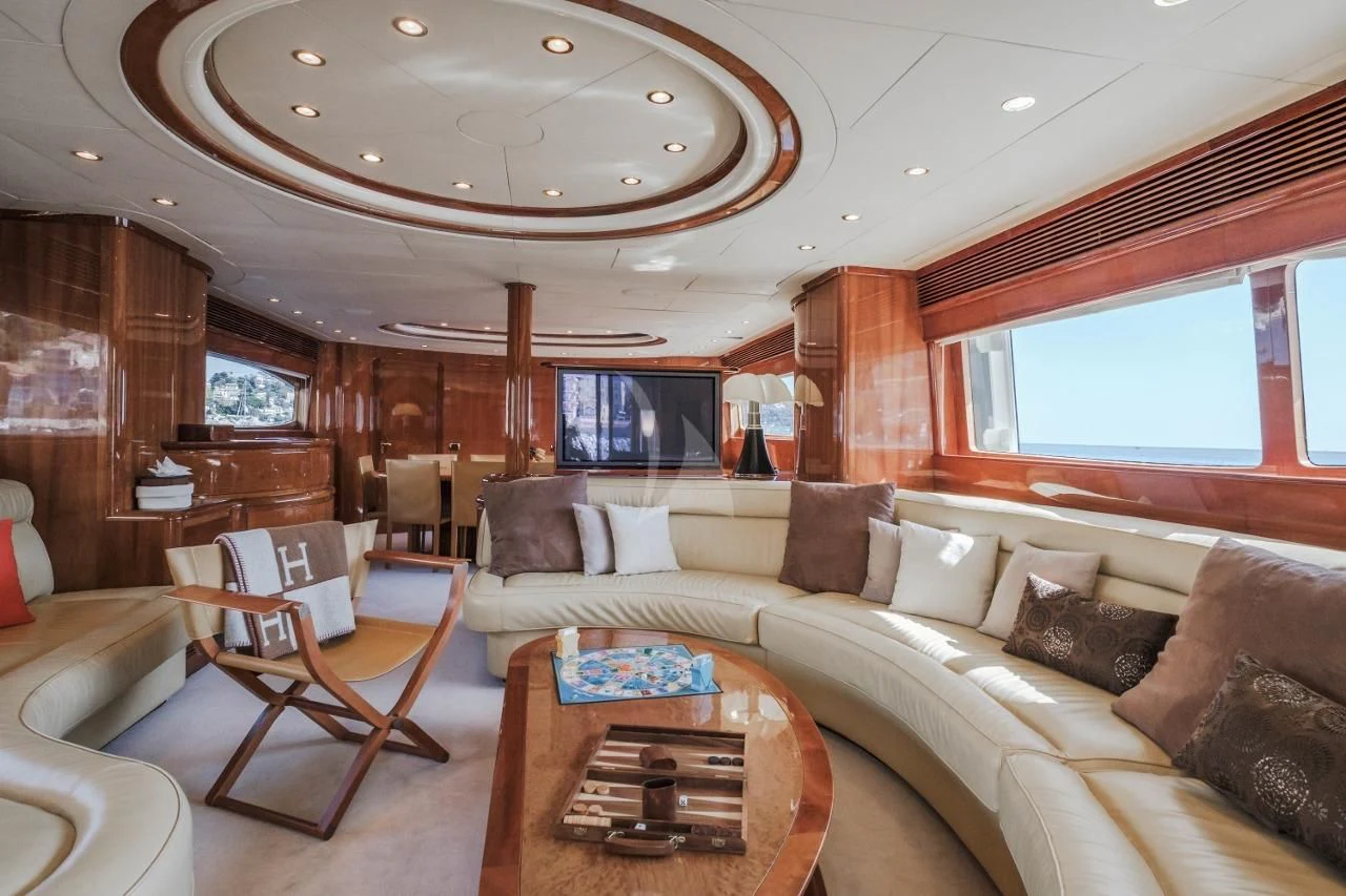 a living room with a couch and a table aboard BEIJA FLORE Yacht for Charter