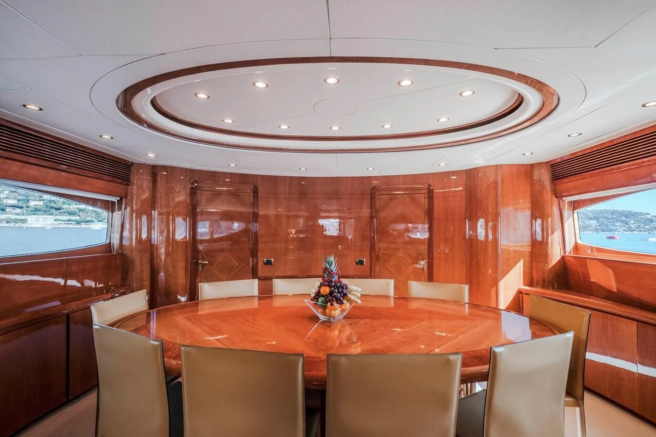 a room with tables and chairs aboard BEIJA FLORE Yacht for Charter