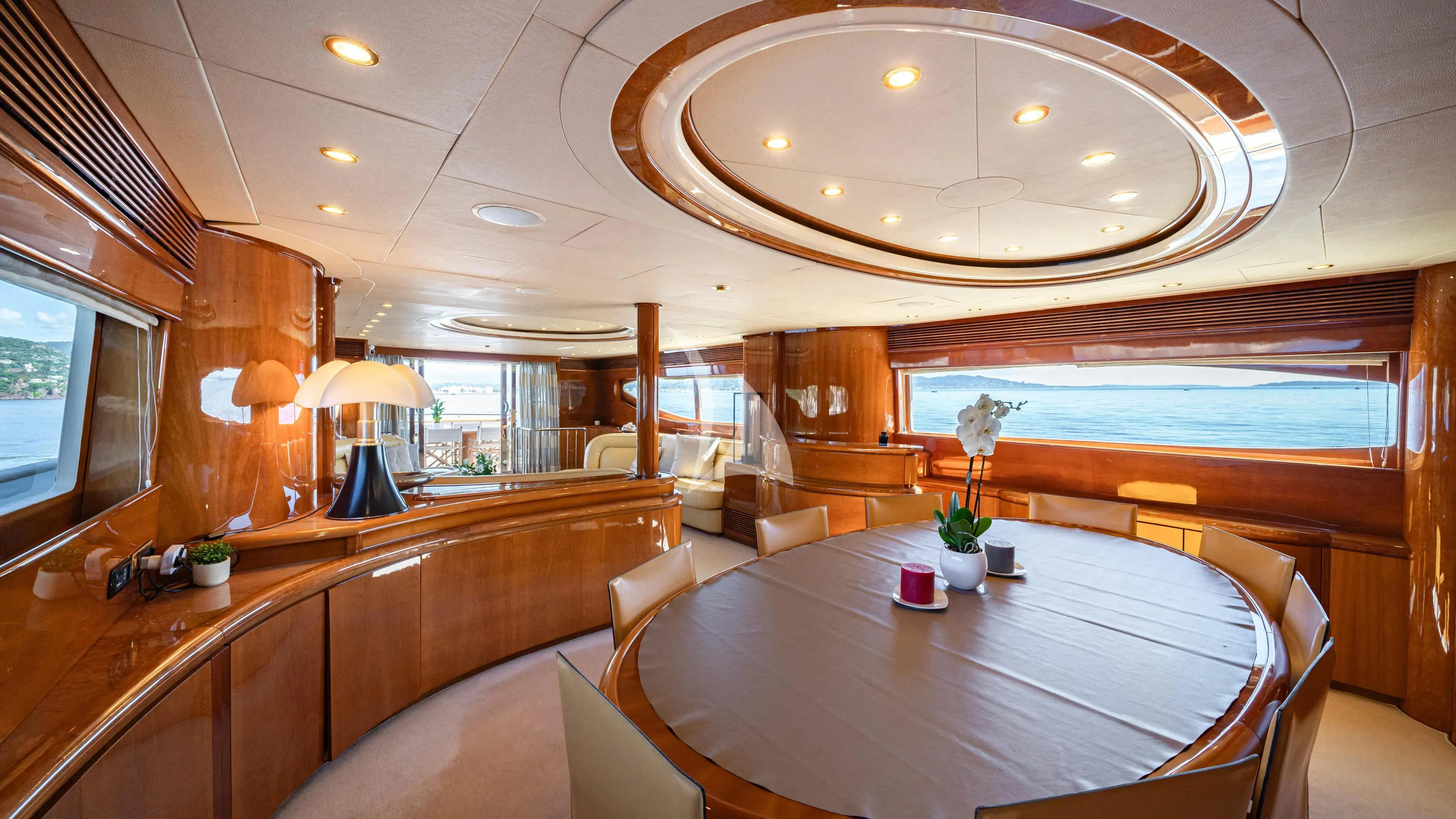 a room with a table and chairs aboard BEIJA FLORE Yacht for Charter