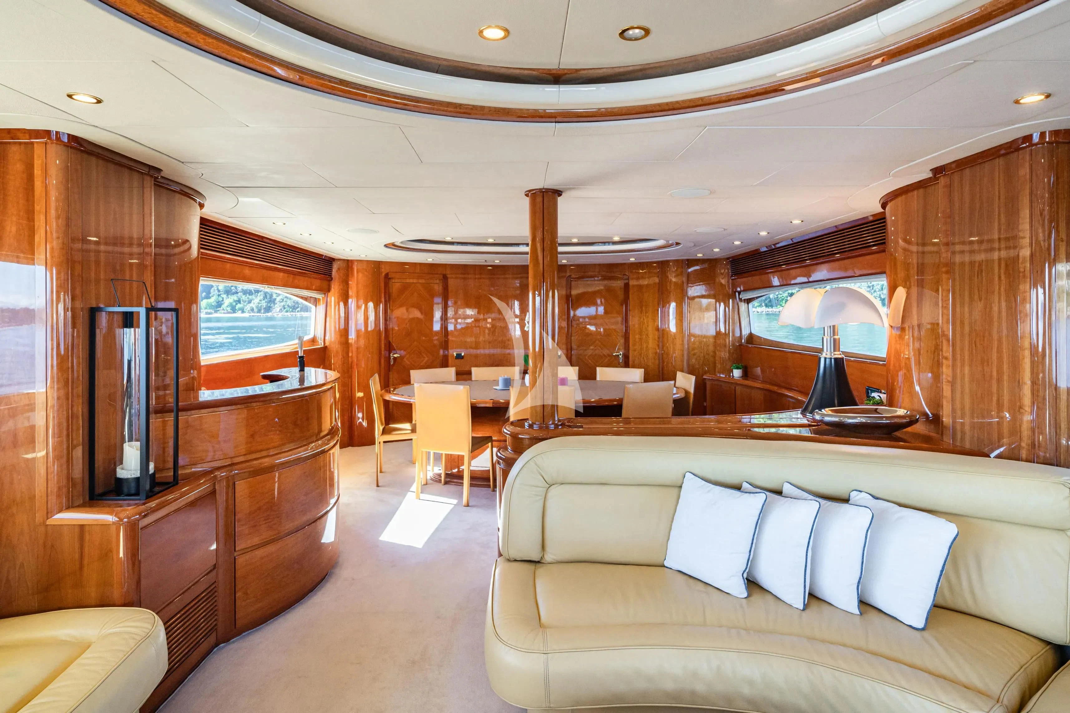 a living room with a couch and a table aboard BEIJA FLORE Yacht for Charter