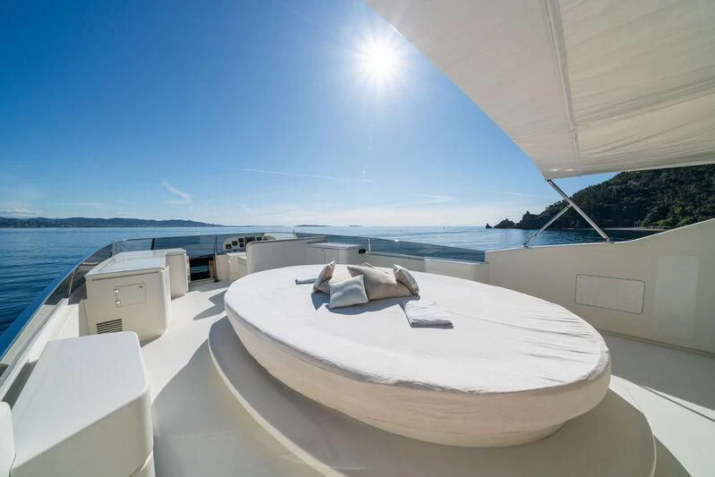 a large white boat on a beach aboard BEIJA FLORE Yacht for Charter