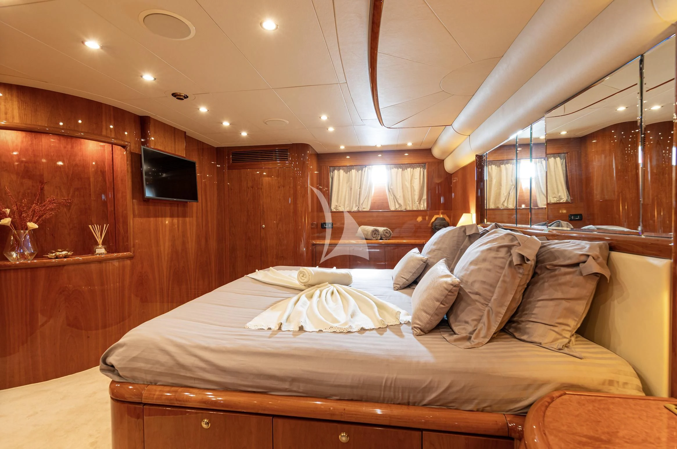a bedroom with a large bed aboard BEIJA FLORE Yacht for Charter