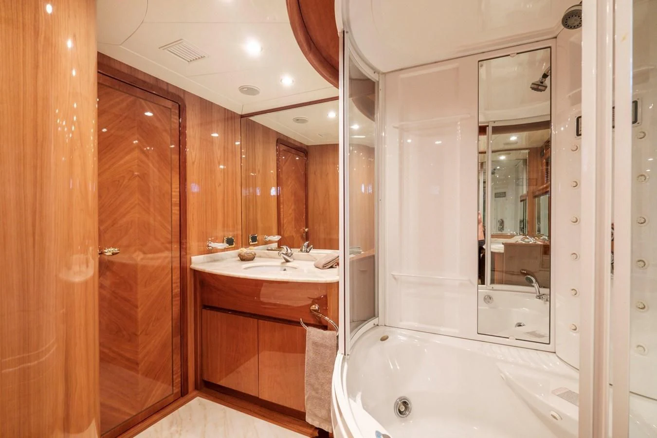 a bathroom with a large mirror aboard BEIJA FLORE Yacht for Charter