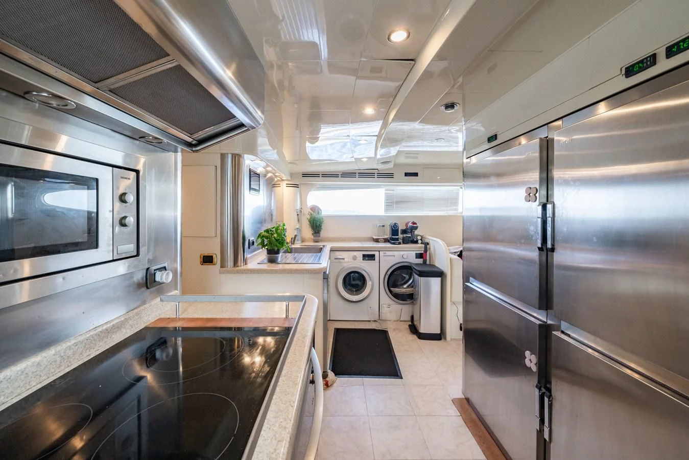 a kitchen with stainless steel appliances aboard BEIJA FLORE Yacht for Charter