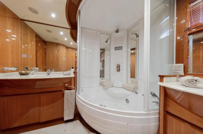 a bathroom with a bathtub and sink aboard BEIJA FLORE Yacht for Charter