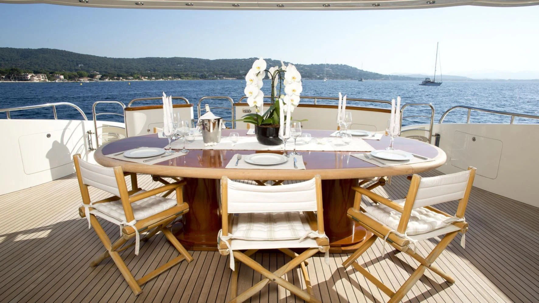 a table set for a dinner on a boat aboard BEIJA FLORE Yacht for Charter