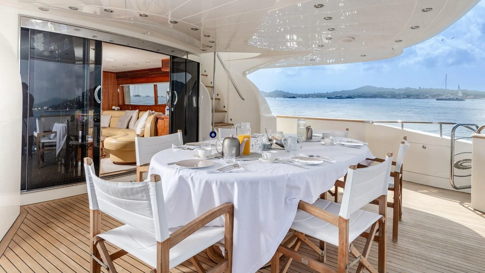 a table set for a meal on a deck aboard BEIJA FLORE Yacht for Charter