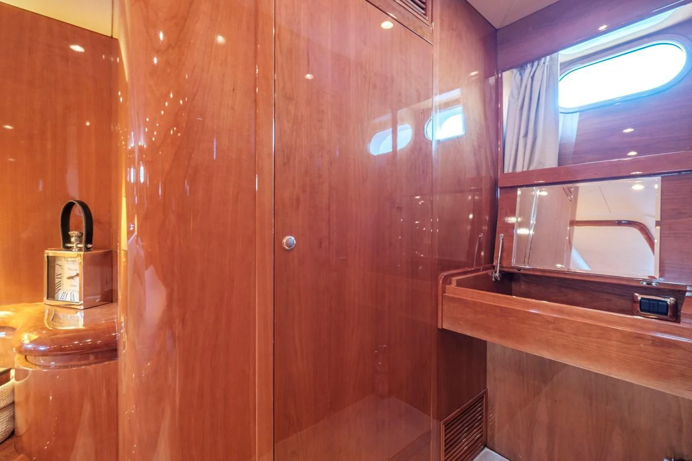 a wooden wall with a mirror aboard BEIJA FLORE Yacht for Charter
