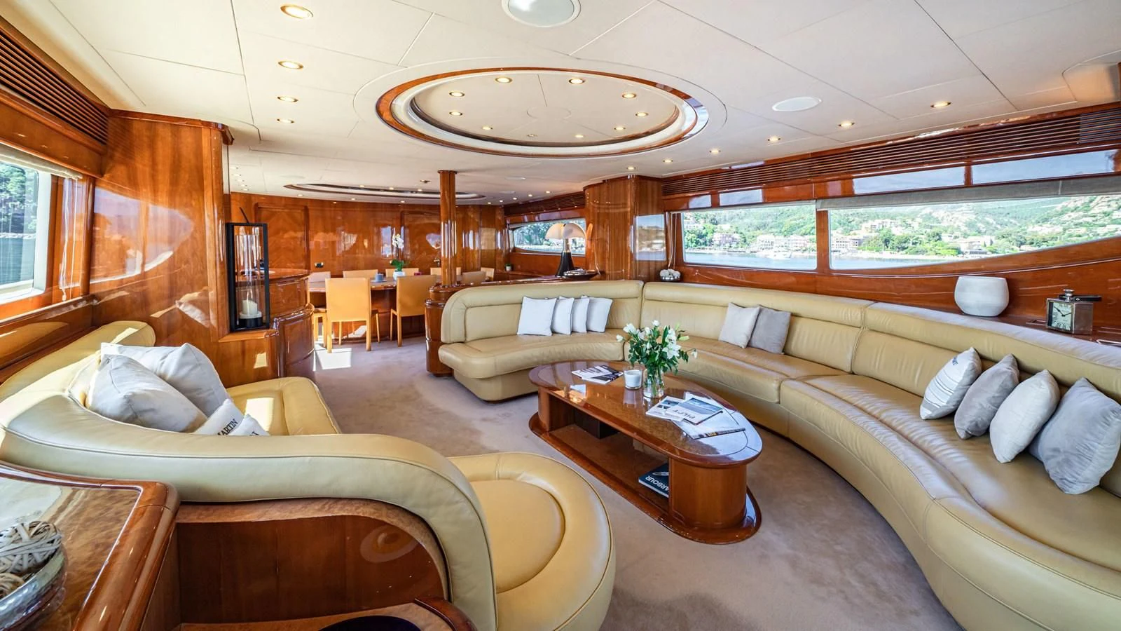 a living room with a couch and a coffee table aboard BEIJA FLORE Yacht for Charter