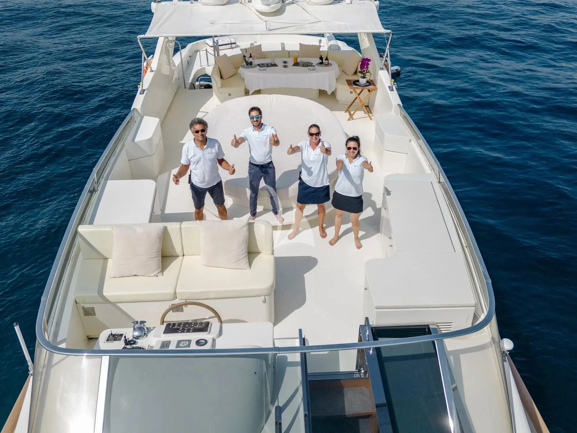 a group of people on a boat aboard BEIJA FLORE Yacht for Charter