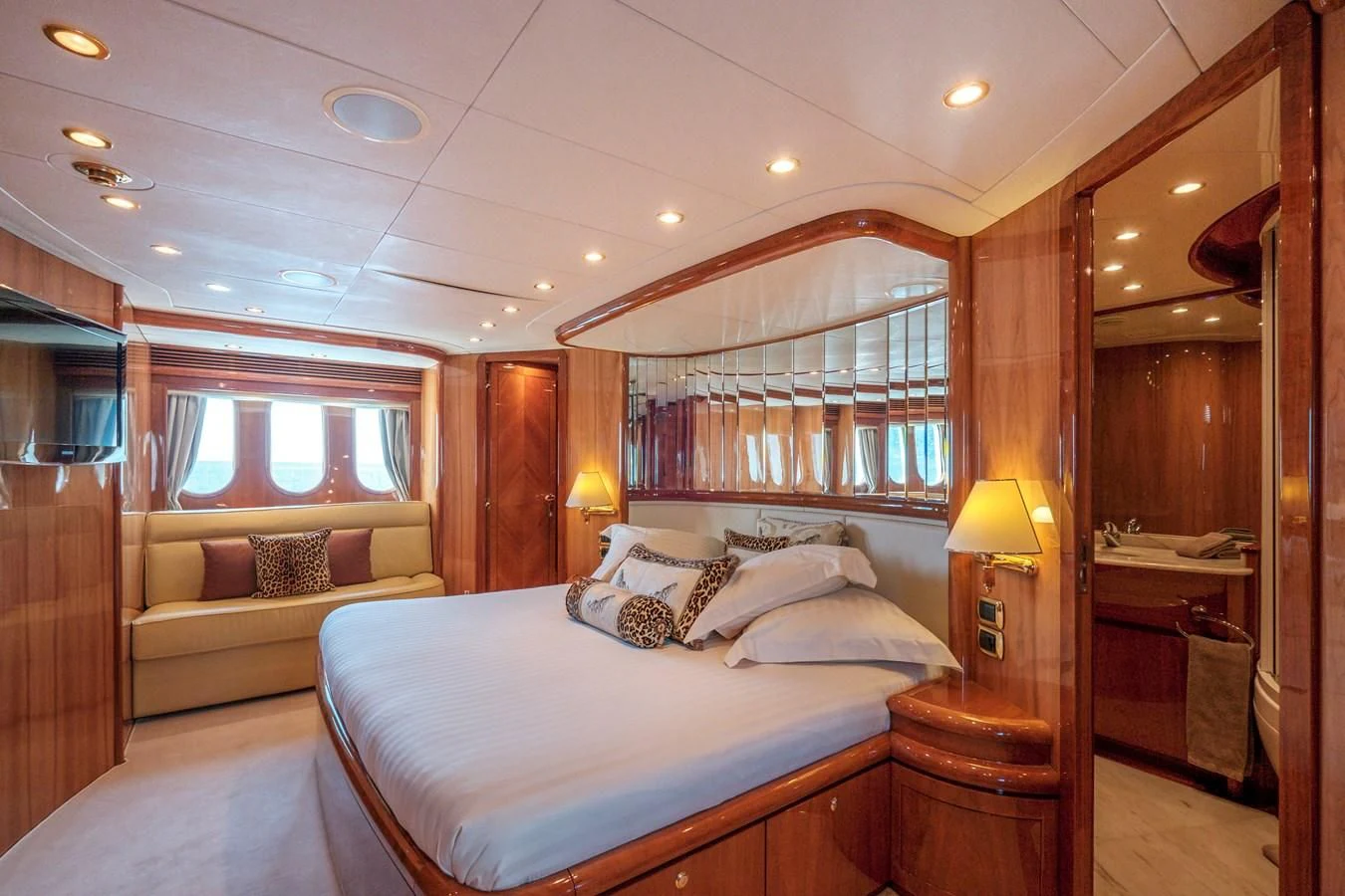 a bedroom with a bed and a couch aboard BEIJA FLORE Yacht for Charter