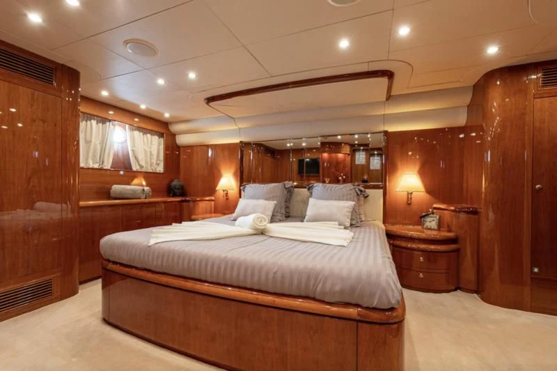 a large bed in a room aboard BEIJA FLORE Yacht for Charter