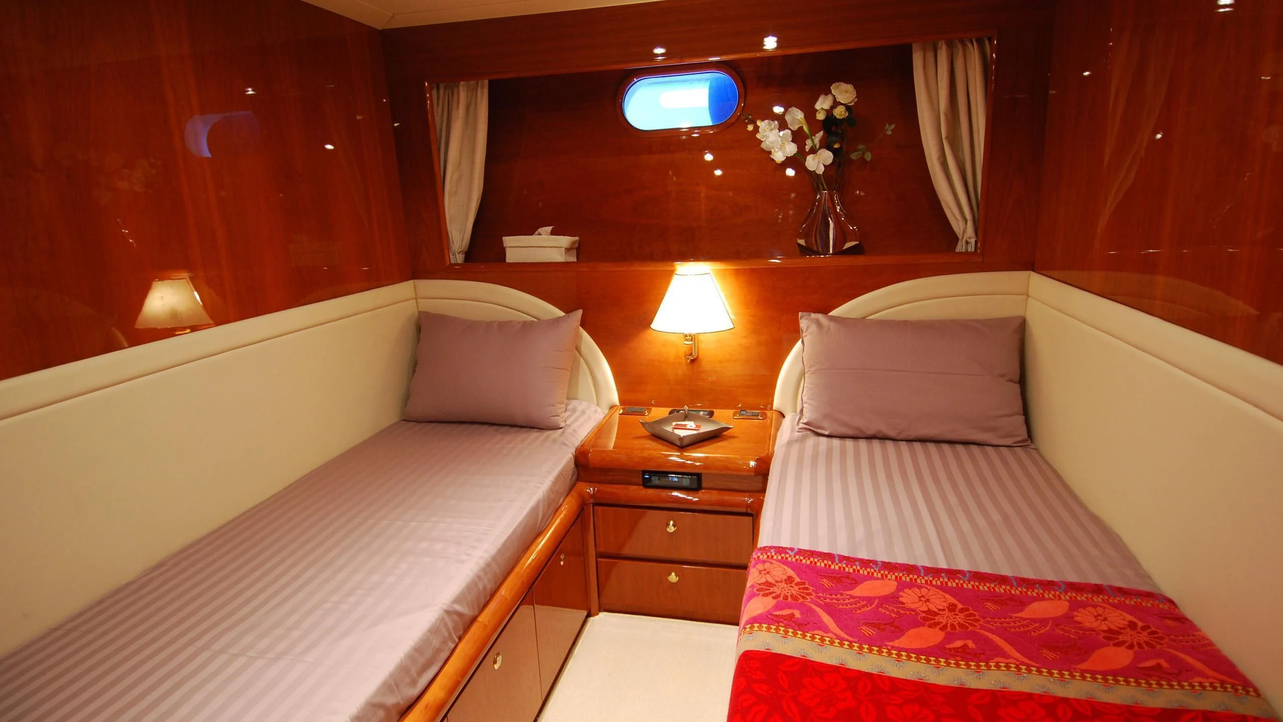 a couple of beds in a hotel room aboard BEIJA FLORE Yacht for Charter