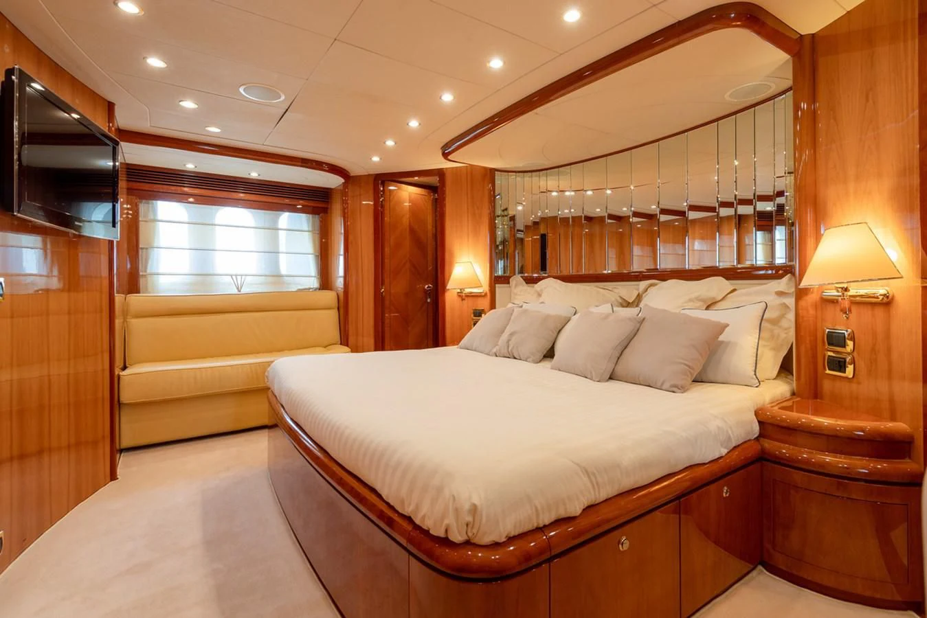 a large bed in a room aboard BEIJA FLORE Yacht for Charter