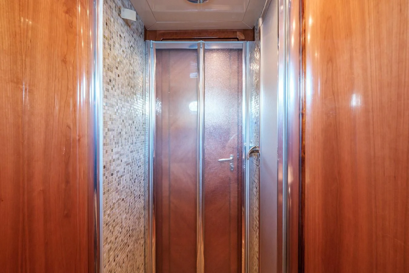 a room with wooden doors aboard BEIJA FLORE Yacht for Charter