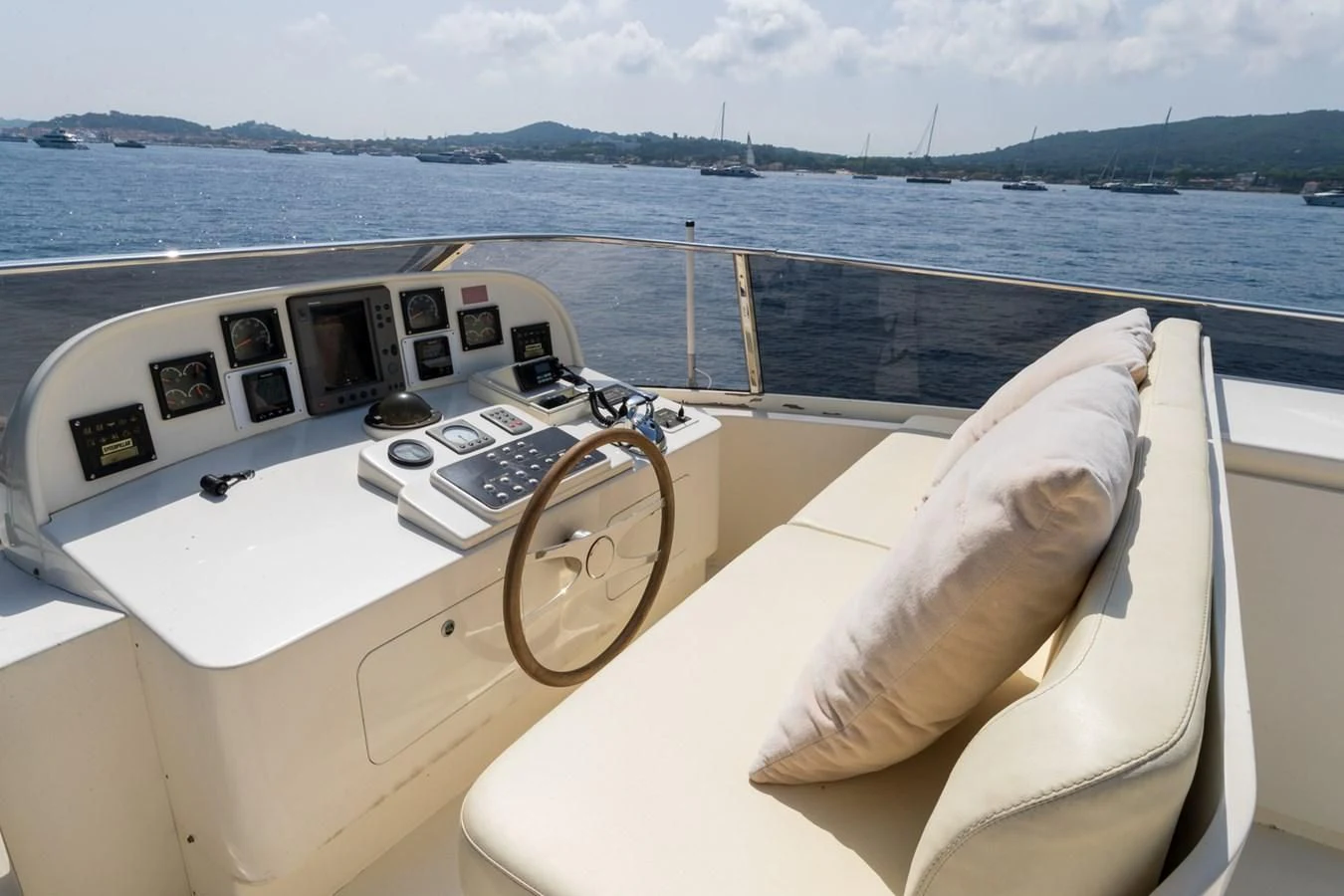 a boat with a seat and a steering wheel on the deck aboard BEIJA FLORE Yacht for Charter