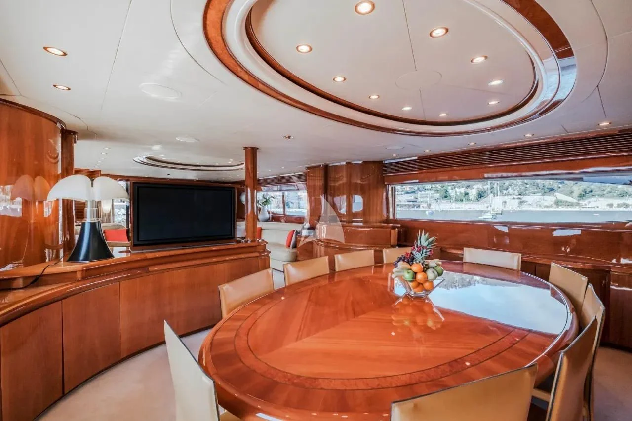a large room with a table and chairs aboard BEIJA FLORE Yacht for Charter
