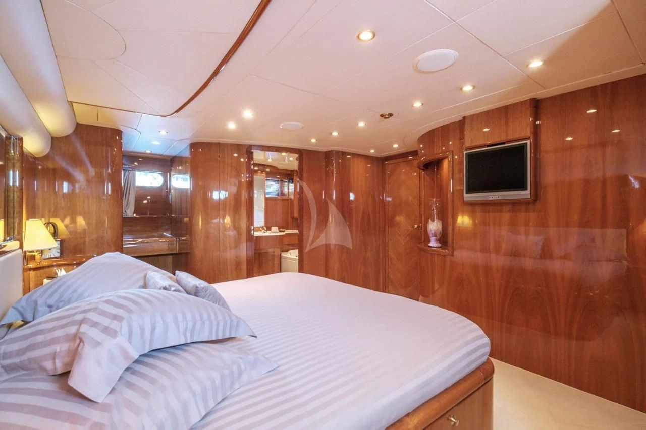 a bed in a wooden room aboard BEIJA FLORE Yacht for Charter