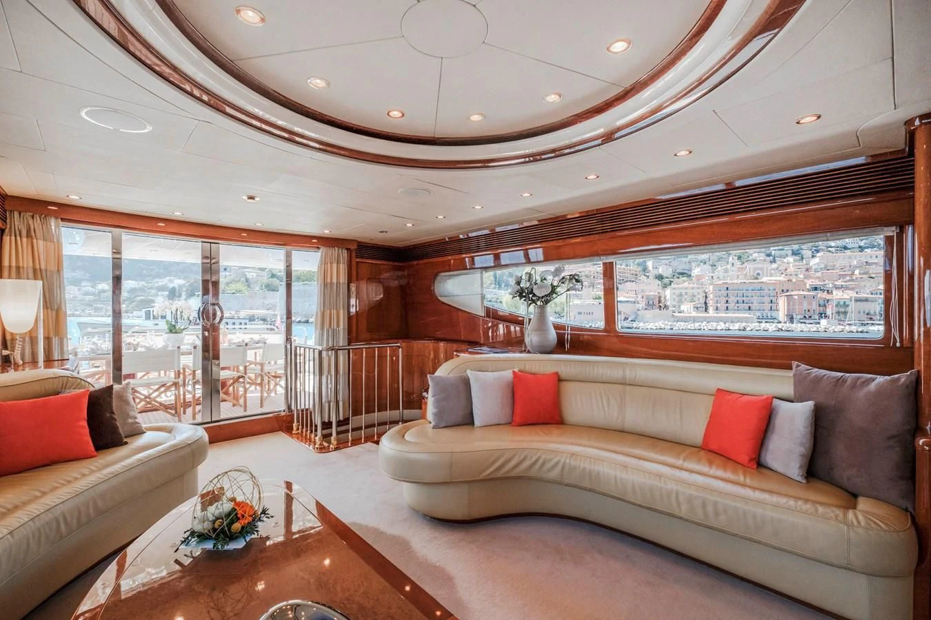 a living room with a large window aboard BEIJA FLORE Yacht for Charter
