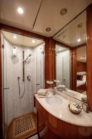 a bathroom with a large mirror aboard BEIJA FLORE Yacht for Charter