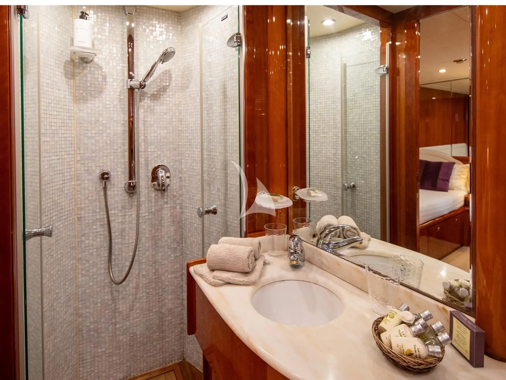 a bathroom with a large mirror aboard BEIJA FLORE Yacht for Charter
