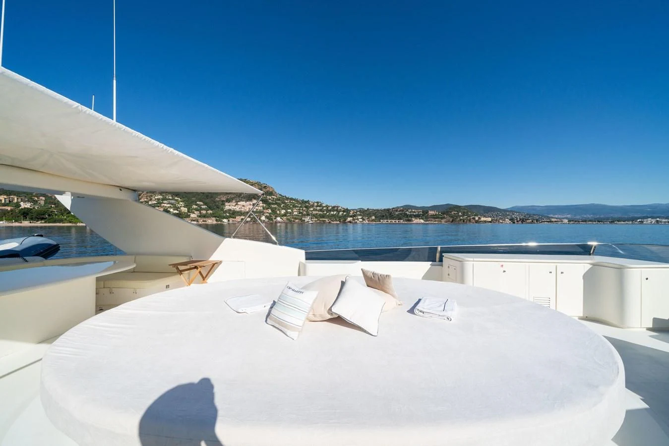 a white building with a roof and a view of the water aboard BEIJA FLORE Yacht for Charter