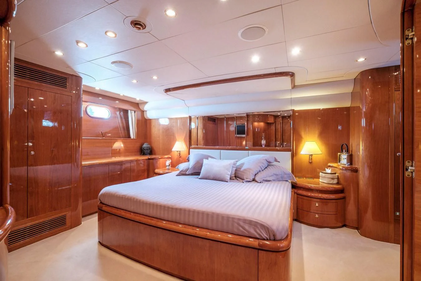a large bed in a room aboard BEIJA FLORE Yacht for Charter
