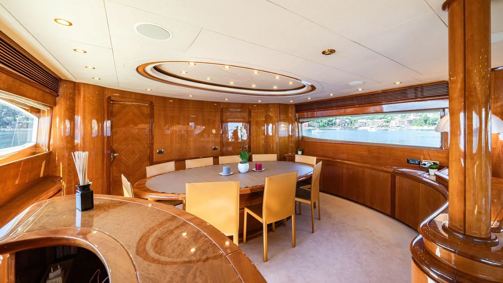 a large room with tables and chairs aboard BEIJA FLORE Yacht for Charter
