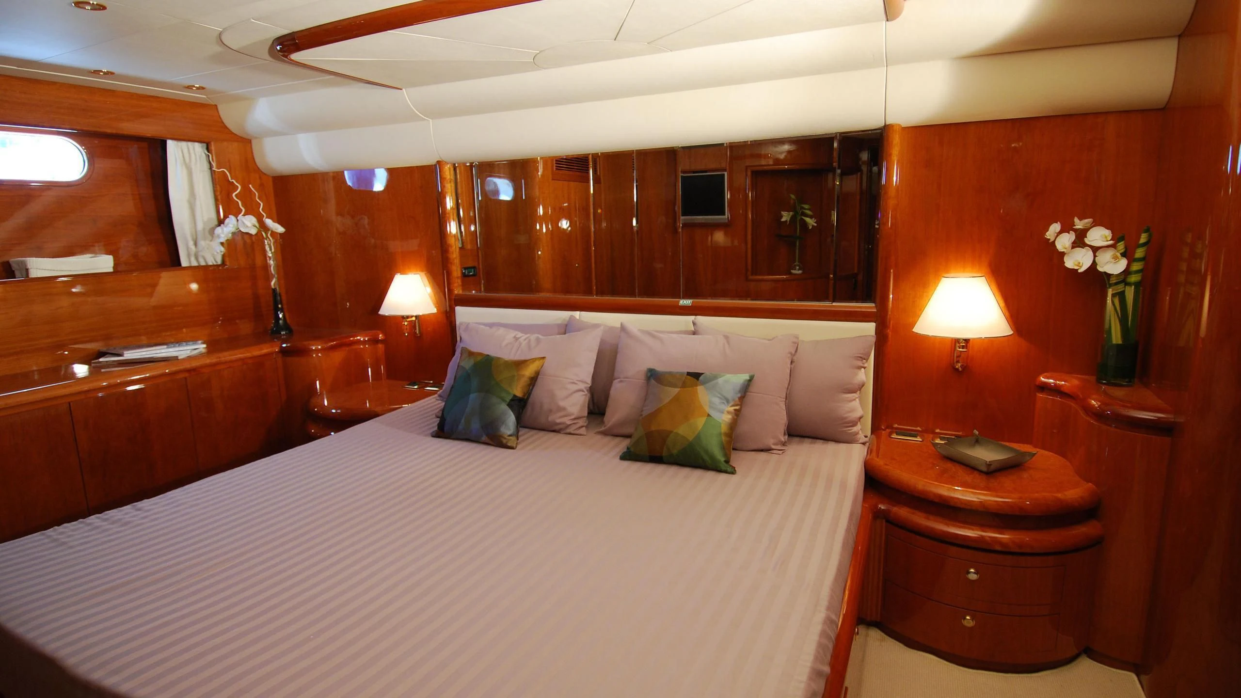 a bed with white sheets and pillows aboard BEIJA FLORE Yacht for Charter
