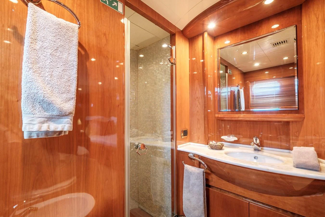 a bathroom with a sink and mirror aboard BEIJA FLORE Yacht for Charter