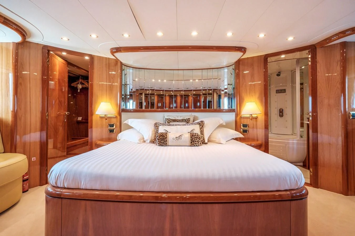 a bed with a white sheet and pillows on it aboard BEIJA FLORE Yacht for Charter