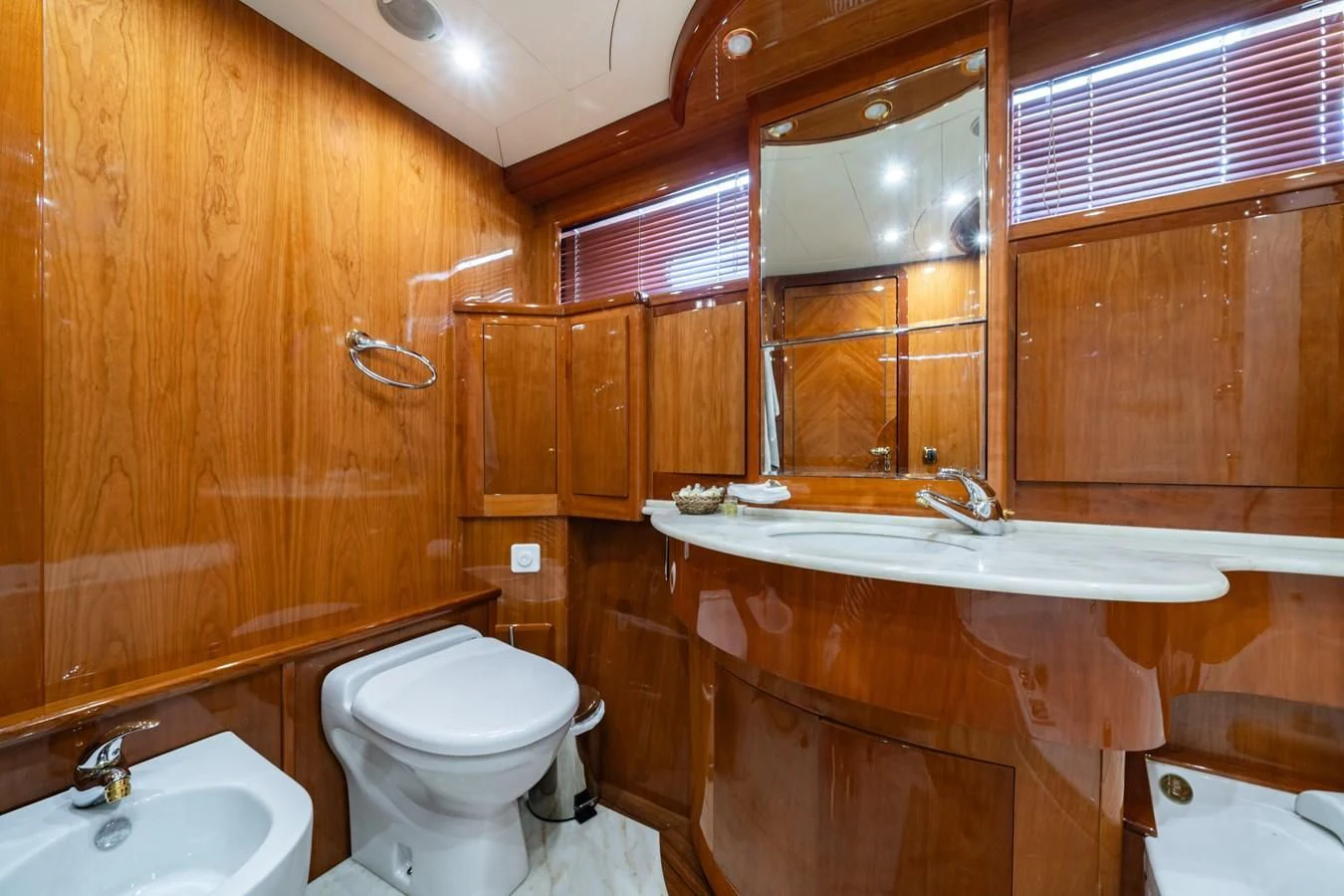 a bathroom with wooden cabinets aboard BEIJA FLORE Yacht for Charter