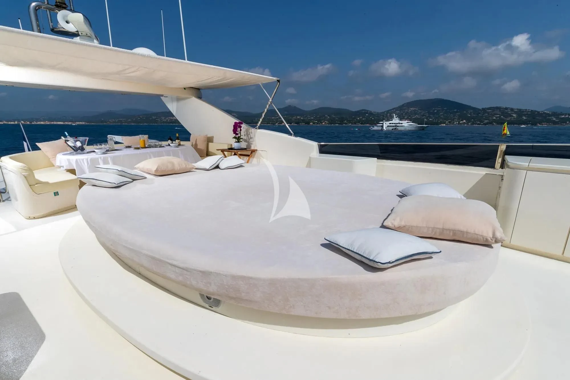 a white bed on a boat aboard BEIJA FLORE Yacht for Charter
