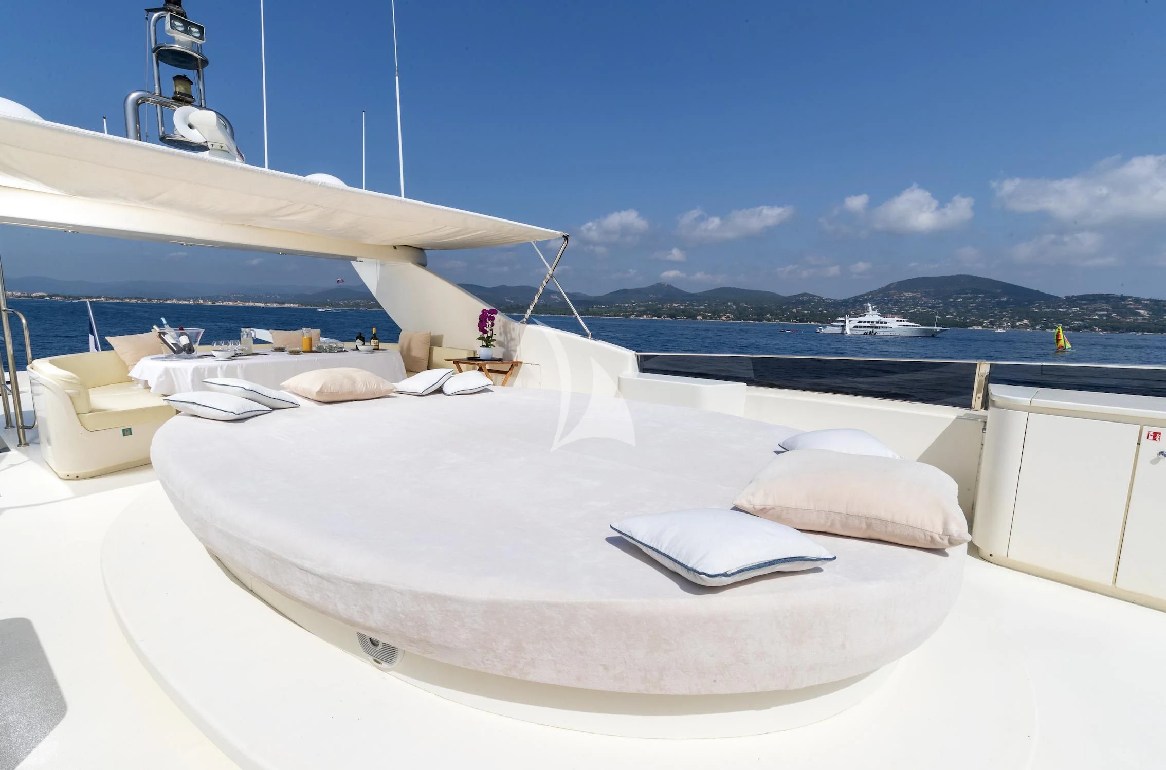a white bed on a boat aboard BEIJA FLORE Yacht for Charter