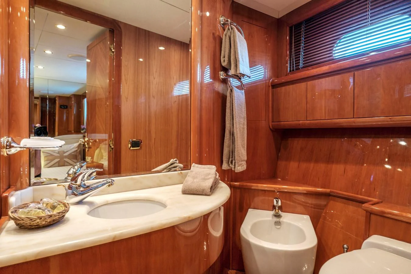 a bathroom with a mirror and a sink aboard BEIJA FLORE Yacht for Charter