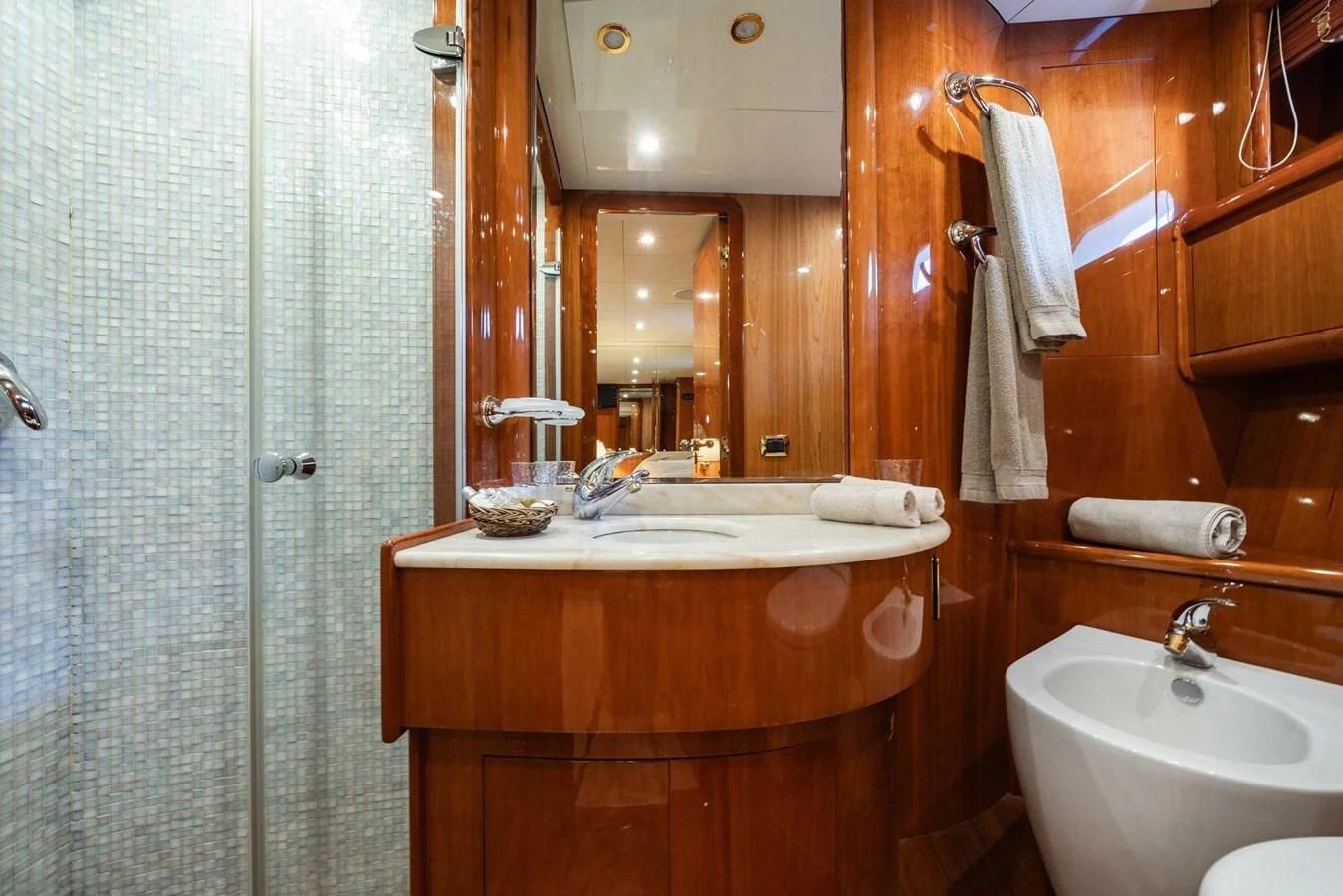 a bathroom with a sink and a mirror aboard BEIJA FLORE Yacht for Charter