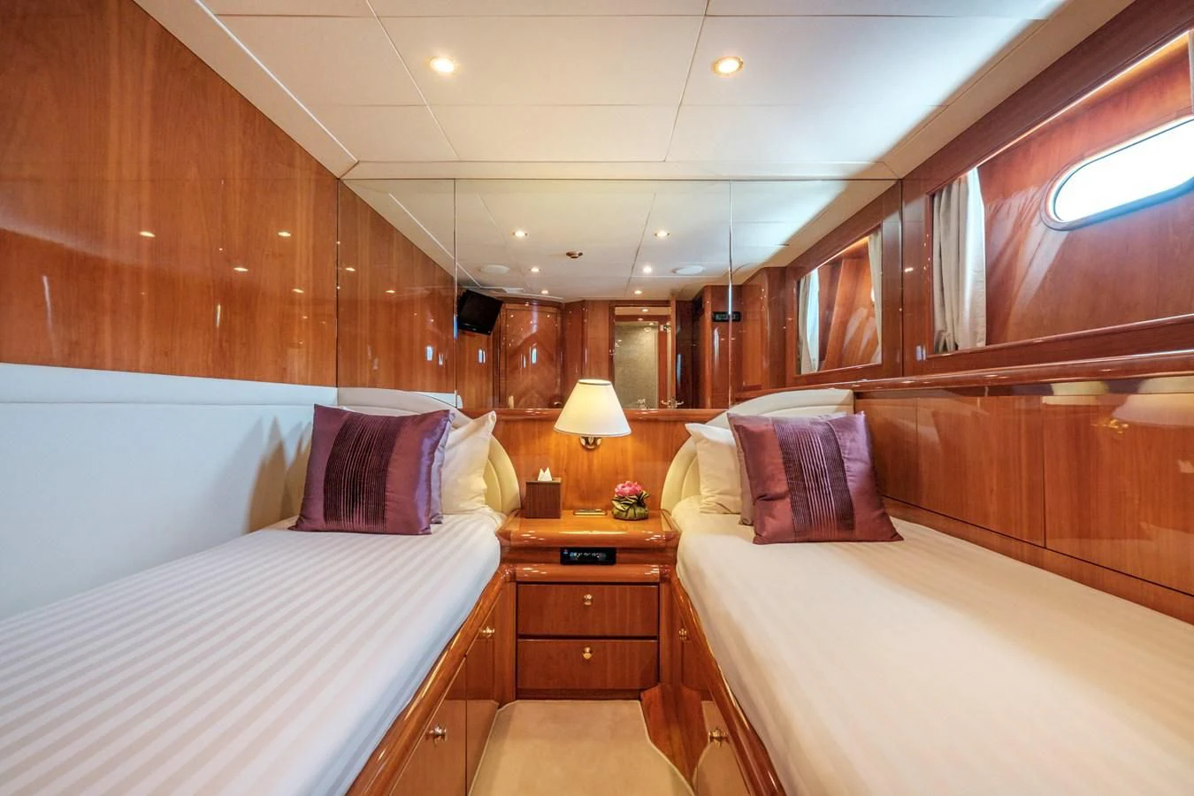 a room with wooden walls and a bed and a wooden bed aboard BEIJA FLORE Yacht for Charter